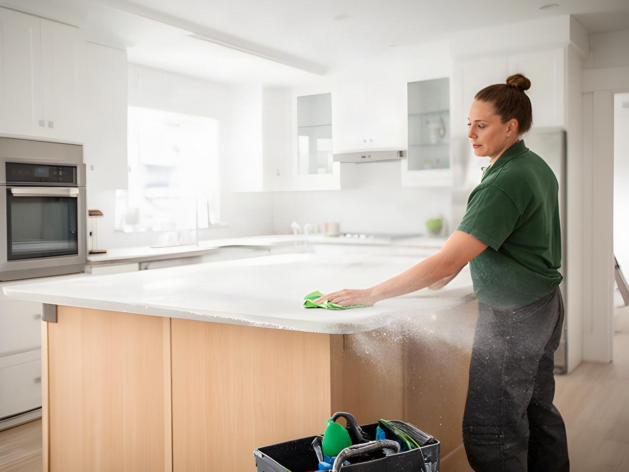 Cleaning professional removing fine renovation dust from a bright Alpena Township kitchen